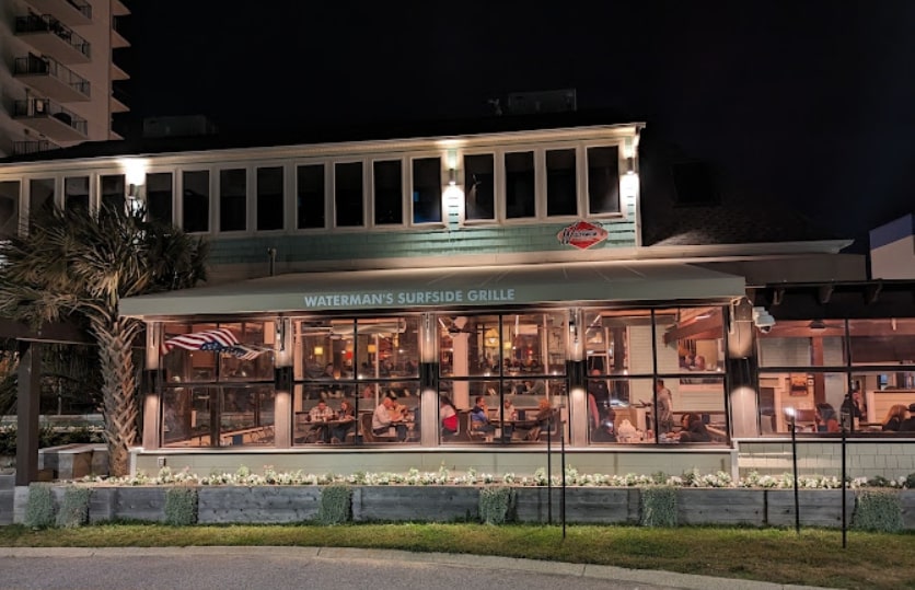 The exterior of Waterman's Surfside Grille at night